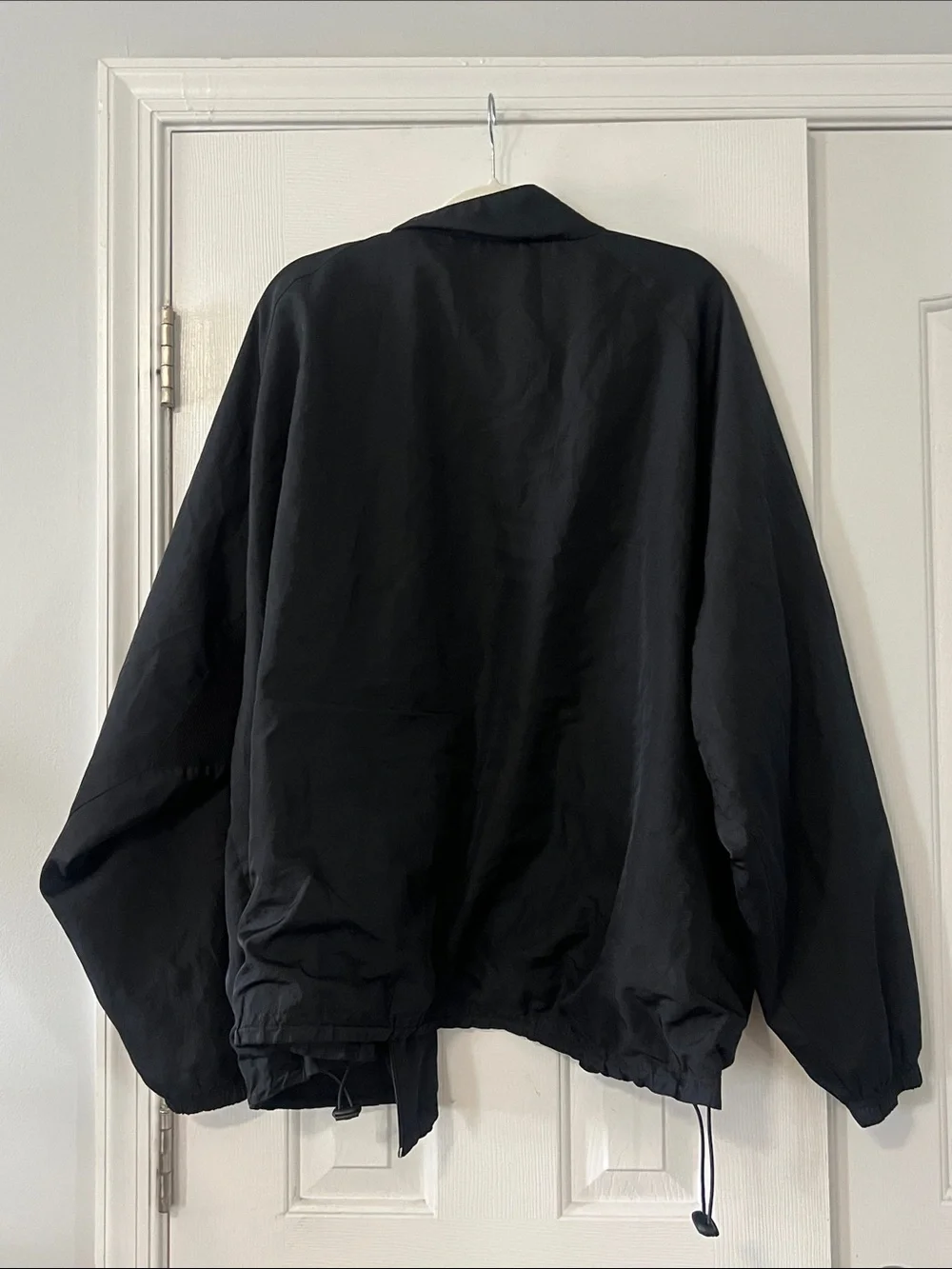 Alphalete Black Windbreaker with White Piping Accents